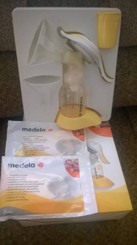 Молокоотсос ручной medela. 