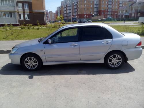  › Модель ­ Mitsubishi Lancer